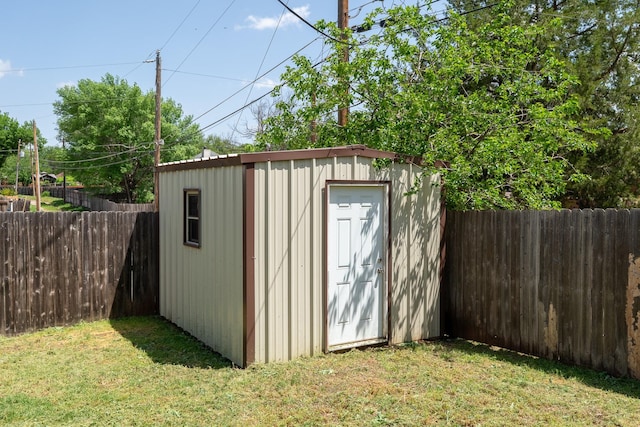 view of shed with a fenced backyard