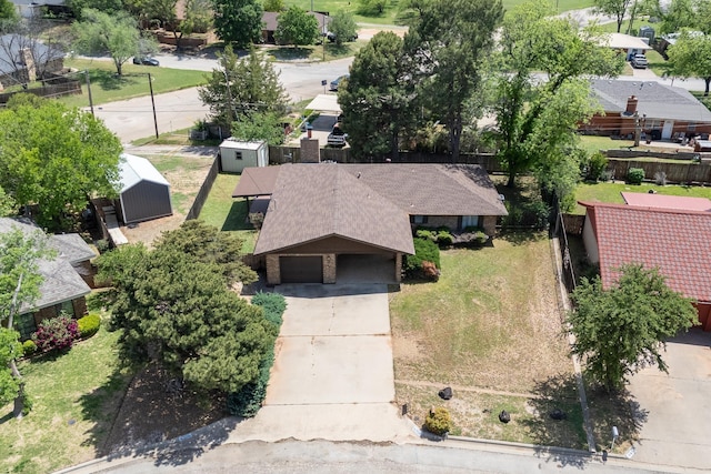 birds eye view of property with a residential view