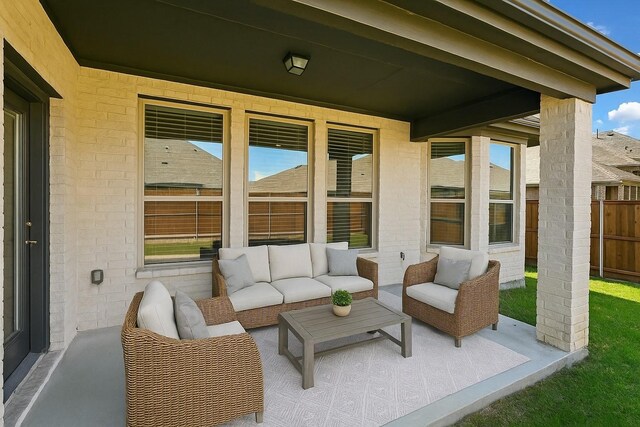 view of patio / terrace with fence and an outdoor living space