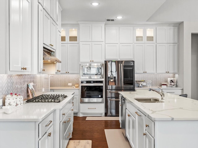 178 Dundee Ct, Argyle, TX 76226 - kitchen with white cabinets, a sink, appliances with stainless steel finishes, and a center island with sink