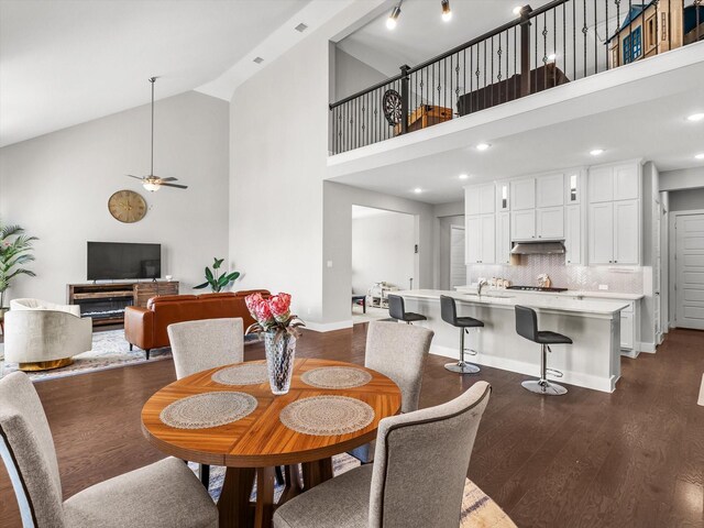 178 Dundee Ct, Argyle, TX 76226 - dining room featuring a ceiling fan, baseboards, high vaulted ceiling, and dark wood-type flooring