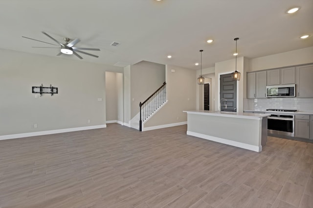 731 Calvin Way, Celina, TX 75009 - unfurnished room with wood finished floors, baseboards, and ceiling fan