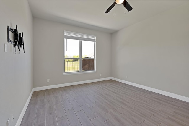 731 Calvin Way, Celina, TX 75009 - unfurnished room with baseboards, wood finished floors, and a ceiling fan