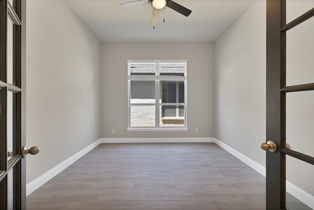 731 Calvin Way, Celina, TX 75009 - unfurnished room featuring a ceiling fan, baseboards, and wood finished floors