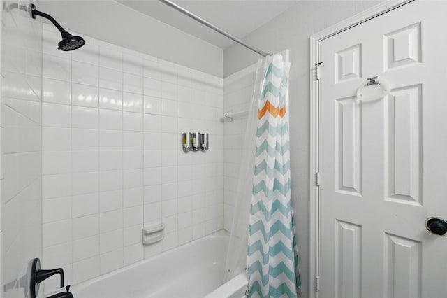 bathroom with shower / bath combo