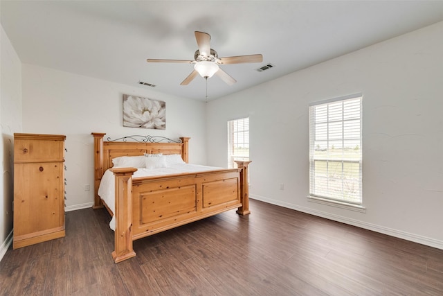 3450 County Road 2156, Caddo Mills, TX 75135 - bedroom featuring dark wood-type flooring, baseboards, and ceiling fan