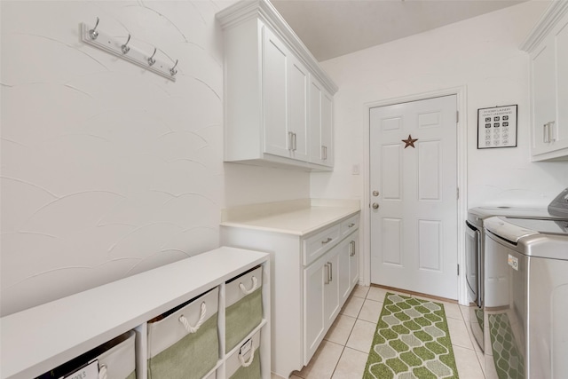 3450 County Road 2156, Caddo Mills, TX 75135 - washroom featuring cabinet space, washing machine and clothes dryer, and light tile patterned flooring