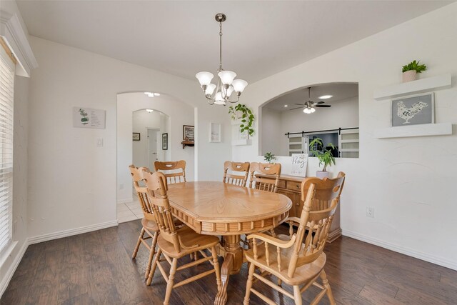 3450 County Road 2156, Caddo Mills, TX 75135 - dining space featuring arched walkways, ceiling fan, wood finished floors, a chandelier, and baseboards