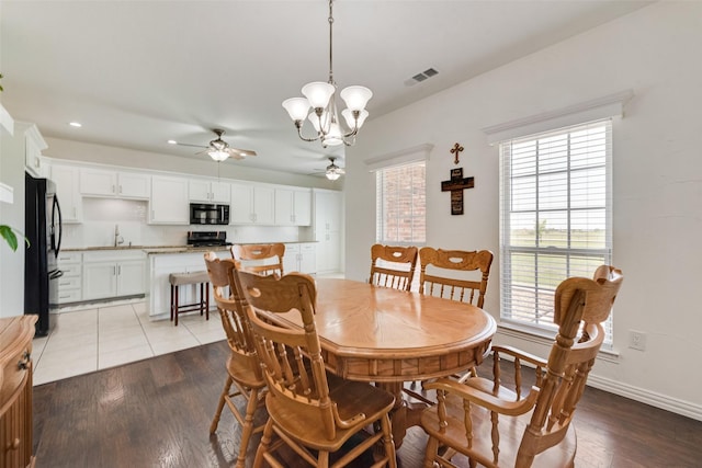 3450 County Road 2156, Caddo Mills, TX 75135 - dining space with ceiling fan, a chandelier, recessed lighting, wood finished floors, and baseboards