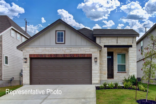 1385 Cider St, Forney, TX 75126 - view of front of house with board and batten siding, driveway, stone siding, a front yard, and a garage