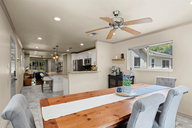 4829 Red Oak Ln, River Oaks, TX 76114 - dining space featuring plenty of natural light, visible vents, and crown molding