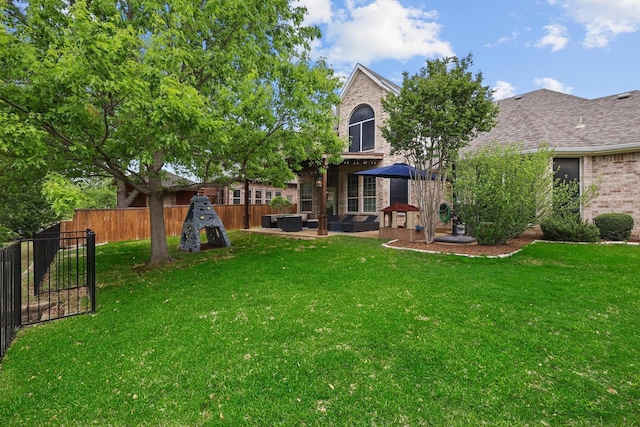 view of yard with an outdoor living space, a patio area, and a fenced backyard