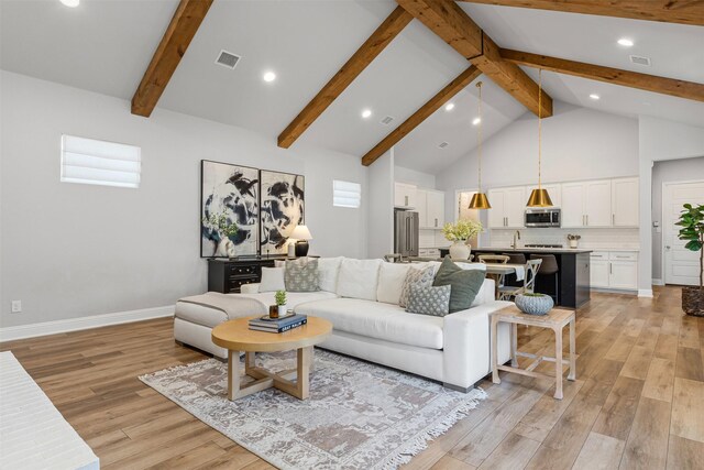 13645 Sweetwalk Pl, Fort Worth, TX 76008 - living area with light wood finished floors, high vaulted ceiling, beamed ceiling, recessed lighting, and baseboards