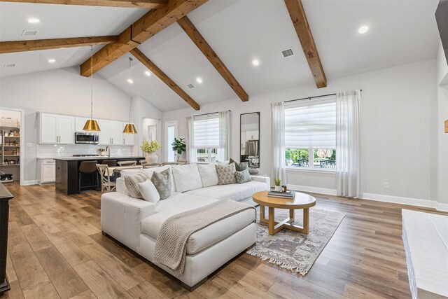 13645 Sweetwalk Pl, Fort Worth, TX 76008 - living room with light wood-style flooring, beamed ceiling, recessed lighting, high vaulted ceiling, and baseboards