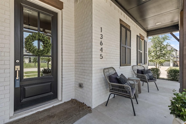 13645 Sweetwalk Pl, Fort Worth, TX 76008 - entrance to property featuring a porch and brick siding