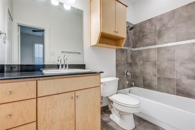 3907 Cole Ave Unit 5, Dallas, TX 75204 - full bathroom featuring tile patterned flooring, toilet, vanity, and shower / bathing tub combination