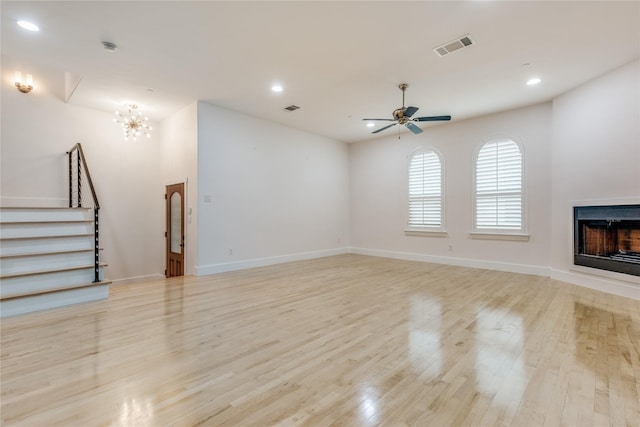 3907 Cole Ave Unit 5, Dallas, TX 75204 - unfurnished living room featuring a fireplace, light wood-style flooring, visible vents, and recessed lighting