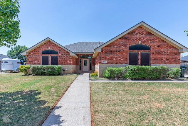 7018 Waterway Ln, Abilene, TX 79606 - view of front facade featuring brick siding, a shingled roof, and a front yard