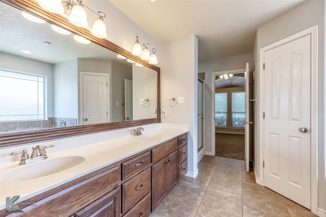 7018 Waterway Ln, Abilene, TX 79606 - bathroom with tile patterned floors, a sink, and plenty of natural light