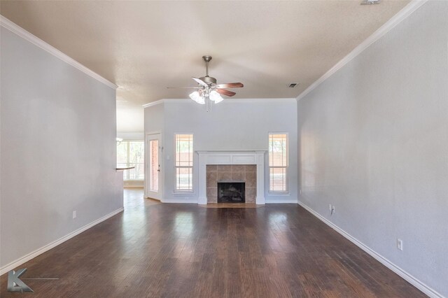 7018 Waterway Ln, Abilene, TX 79606 - unfurnished living room with dark wood-style floors, a ceiling fan, crown molding, baseboards, and a fireplace
