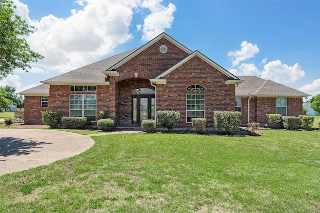 110 Bob White Cir, Lorena, TX 76655 - view of front of home featuring brick siding, a shingled roof, and a front yard