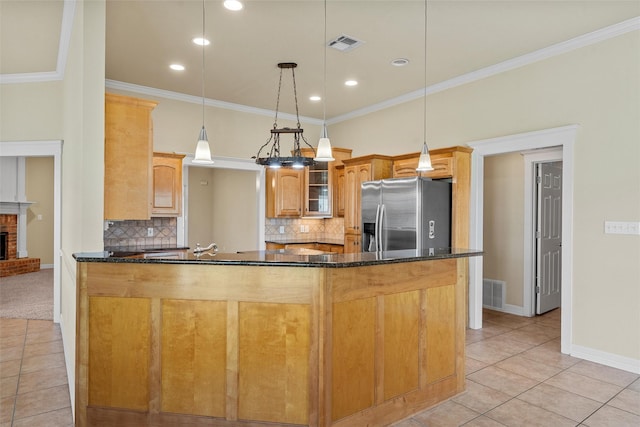 110 Bob White Cir, Lorena, TX 76655 - kitchen with light tile patterned floors, backsplash, a peninsula, visible vents, and stainless steel refrigerator with ice dispenser