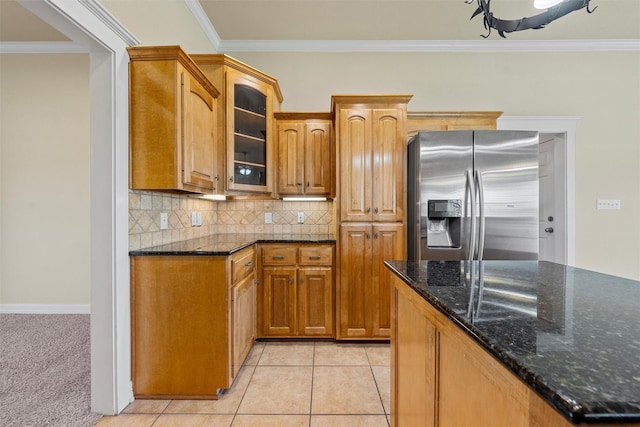 110 Bob White Cir, Lorena, TX 76655 - kitchen featuring dark stone countertops, glass insert cabinets, decorative backsplash, stainless steel fridge with ice dispenser, and ornamental molding