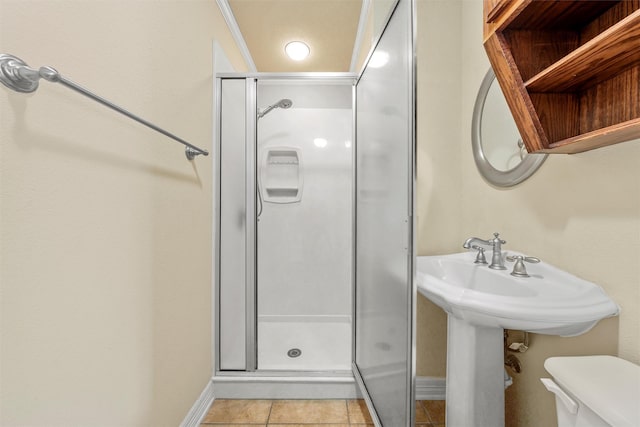 110 Bob White Cir, Lorena, TX 76655 - bathroom with toilet, baseboards, tile patterned flooring, and a stall shower