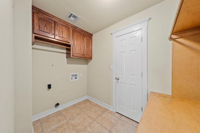 110 Bob White Cir, Lorena, TX 76655 - clothes washing area featuring visible vents, light tile patterned floors, hookup for an electric dryer, cabinet space, and washer hookup