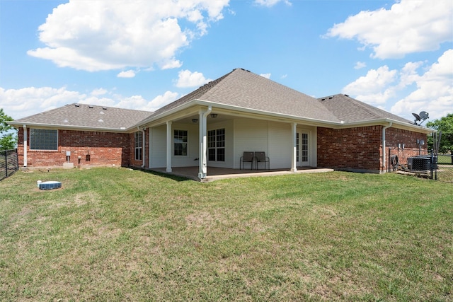 110 Bob White Cir, Lorena, TX 76655 - back of property featuring a fenced backyard, roof with shingles, brick siding, and a patio area