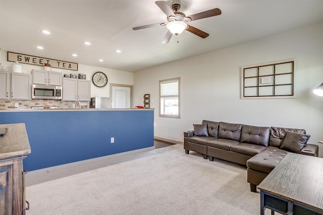 living room featuring recessed lighting, carpet flooring, and ceiling fan