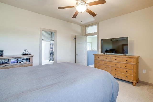 bedroom featuring ceiling fan, baseboards, and light colored carpet