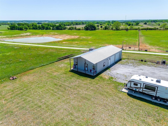 aerial view with a rural view and a water view