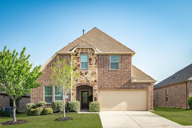 traditional-style home with central AC unit, concrete driveway, stone siding, brick siding, and a front yard