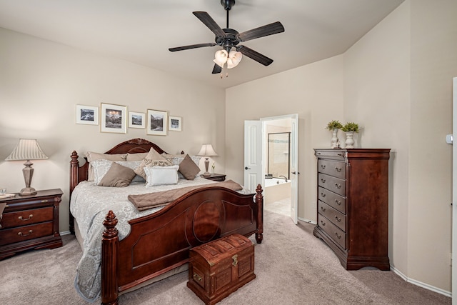bedroom with connected bathroom, ceiling fan, baseboards, and carpet flooring