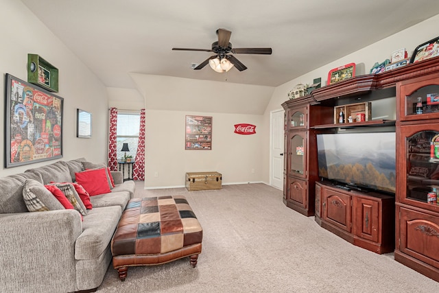 living room with light carpet, a ceiling fan, baseboards, and vaulted ceiling