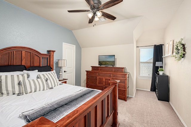 bedroom featuring vaulted ceiling, visible vents, baseboards, light colored carpet, and a ceiling fan