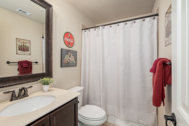 full bathroom with a textured ceiling, visible vents, toilet, and vanity
