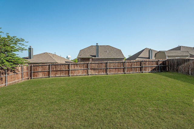 view of yard featuring a fenced backyard