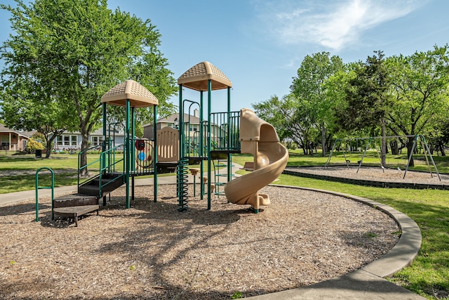 community jungle gym with a lawn