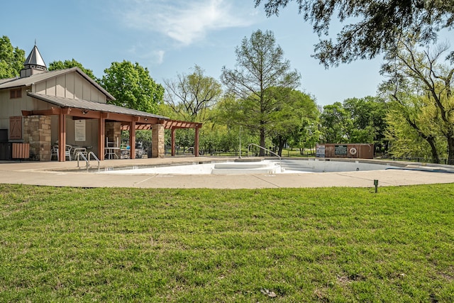 view of community with a patio area and a yard