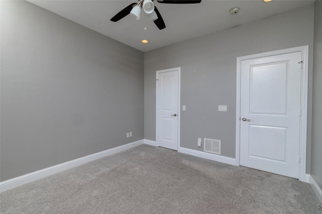carpeted empty room featuring recessed lighting, visible vents, a ceiling fan, and baseboards