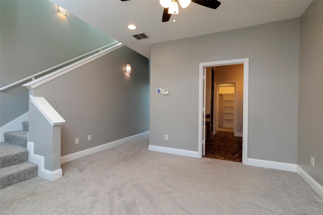additional living space featuring a ceiling fan, stairs, carpet, baseboards, and visible vents