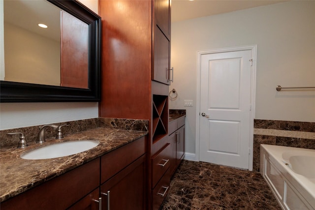 bathroom featuring a bath and vanity