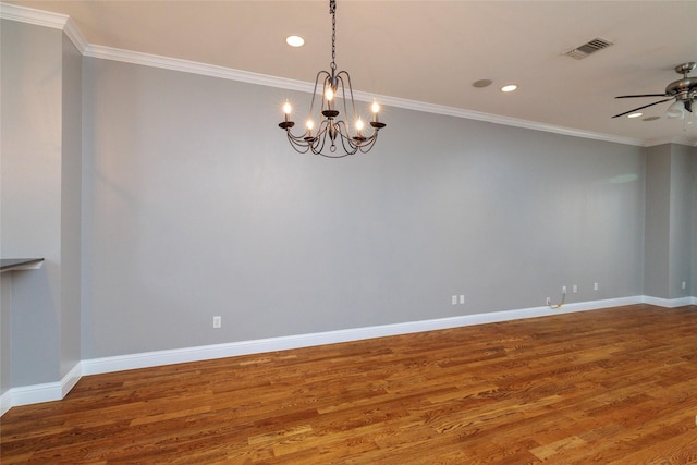 spare room with ceiling fan with notable chandelier, baseboards, wood finished floors, and ornamental molding
