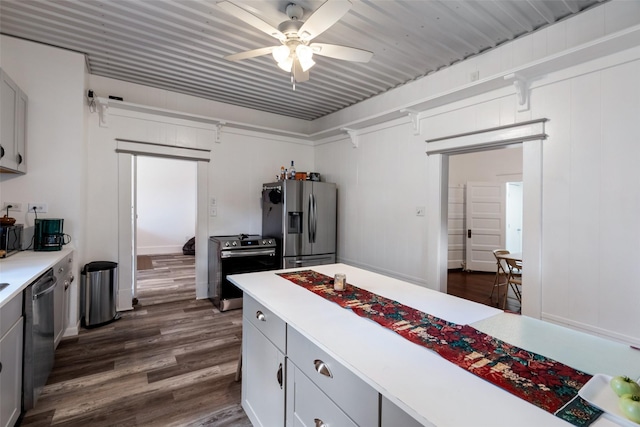 479 County Road 27450, Honey Grove, TX 75477 - kitchen featuring dark wood-style floors, stainless steel appliances, light countertops, gray cabinetry, and ceiling fan