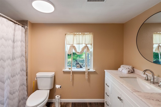 479 County Road 27450, Honey Grove, TX 75477 - bathroom featuring curtained shower, wood finished floors, visible vents, toilet, and vanity