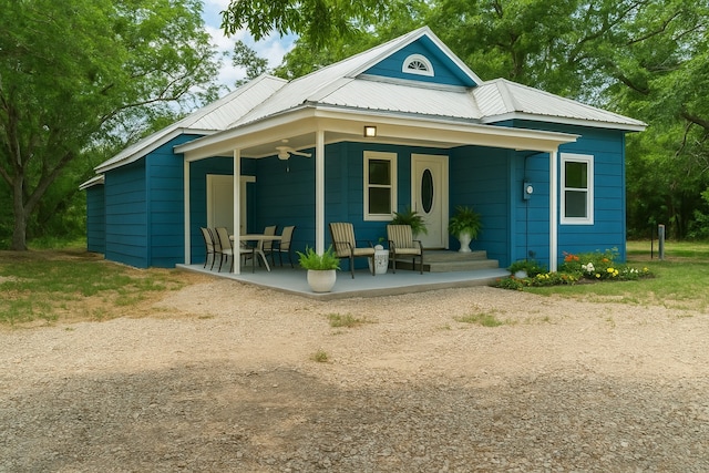479 County Road 27450, Honey Grove, TX 75477 - back of property with a ceiling fan, covered porch, and metal roof
