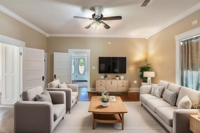 479 County Road 27450, Honey Grove, TX 75477 - living area with light wood finished floors, a ceiling fan, visible vents, and crown molding