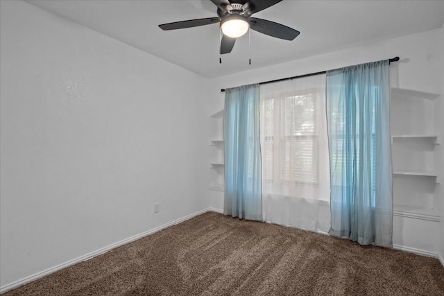 carpeted empty room with ceiling fan